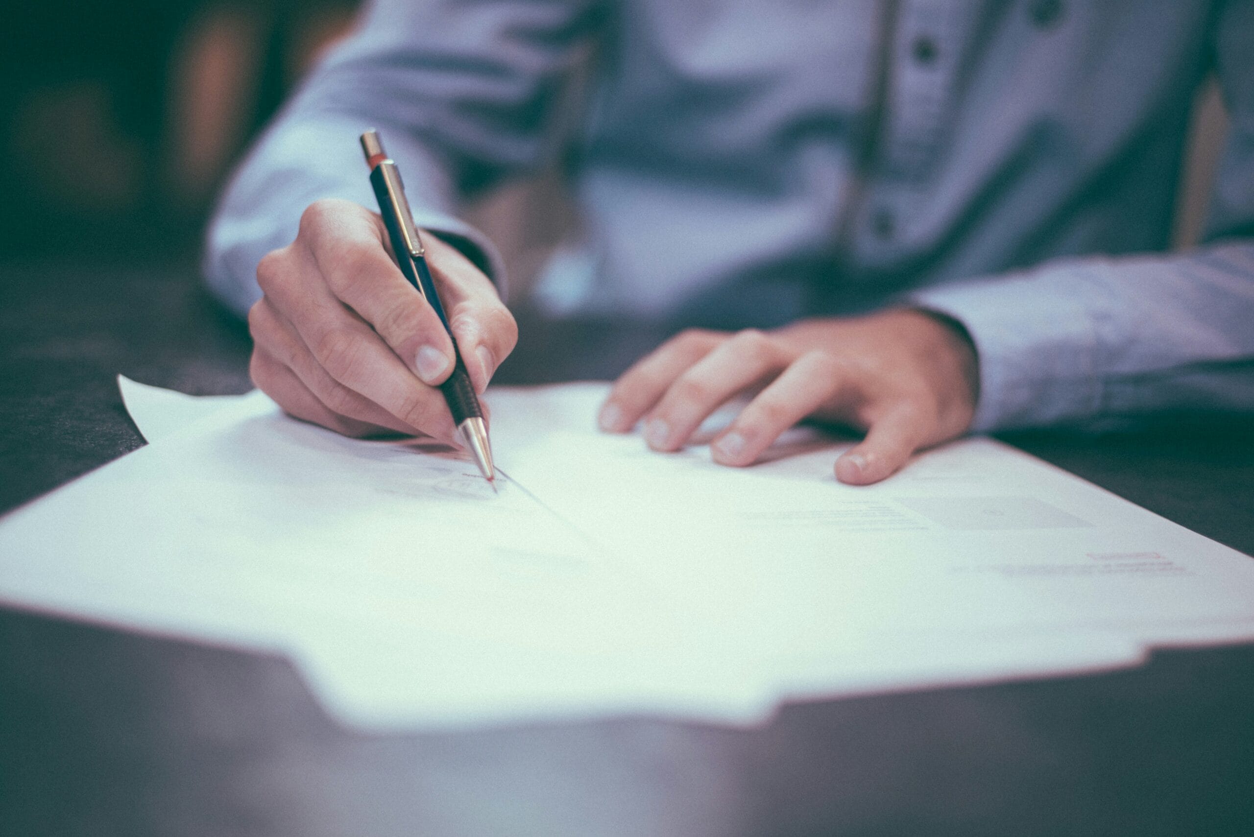 An insurance broker handles paperwork